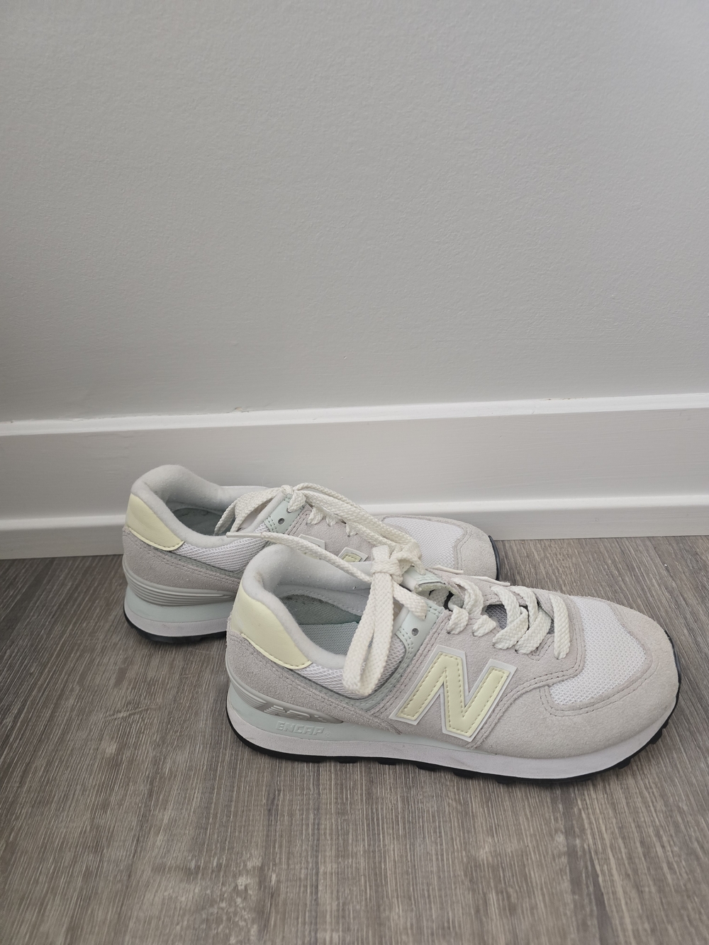 New Balance Women's 574 Classic Sneaker in Light Gray and Cream